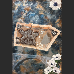 Two partially torn 500 rial banknotes, featuring intricate designs, float against a cosmic background of deep blues and browns. The scene includes a stone bridge below and white flowers with purple centers in the foreground, adding a touch of nature to the surreal composition.
